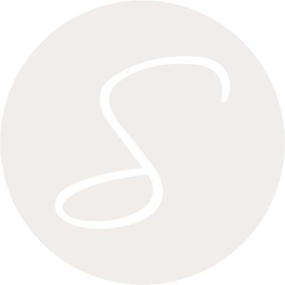 Black cursive letter 'S' on a light gray circular background.